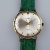 Armbanduhr - "Arctos", 14K Gelbgoldgehäuse, 17 Steine, Handaufzug, metallfarbenes Zifferblatt gemar
