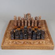 Schachspiel - Bali, Indonesien, 20.Jh., 32 handgeschnitzte Figuren aus Palisanderholz in Form von h