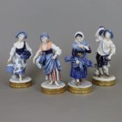 Vier Figuren - Thüringen, 20.Jh., Porzellan, unterglasurblau und goldbemalt, eine farbig, jeweils a