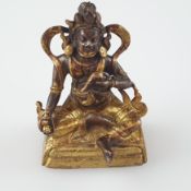 Kleine Jambhala-Figur - Tibet, 18. Jh., feuervergoldete Kupferbronze, der Gott des Reichtums in Lal