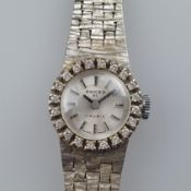 Damenschmuckuhr mit Diamantbesatz- Schweiz, Gehäuse und Armband gestempelt 585/000, rundes Zifferbl