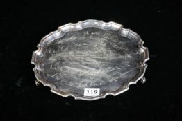 SILVER CIRCULAR TRAY ON 3 FEET. SIGNED & PRESENTED TO 'SIR MYLES HUMPHRIES, ABBEY NATIONAL BOARD'