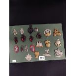 SHEET OF MILITARY AND POLICE BADGES TO INCLUDE RUC/RIC