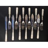 12 PIECE CUTLERY SET WITH MOTHER OF PEARL HANDLES AND SILVER COLLARS