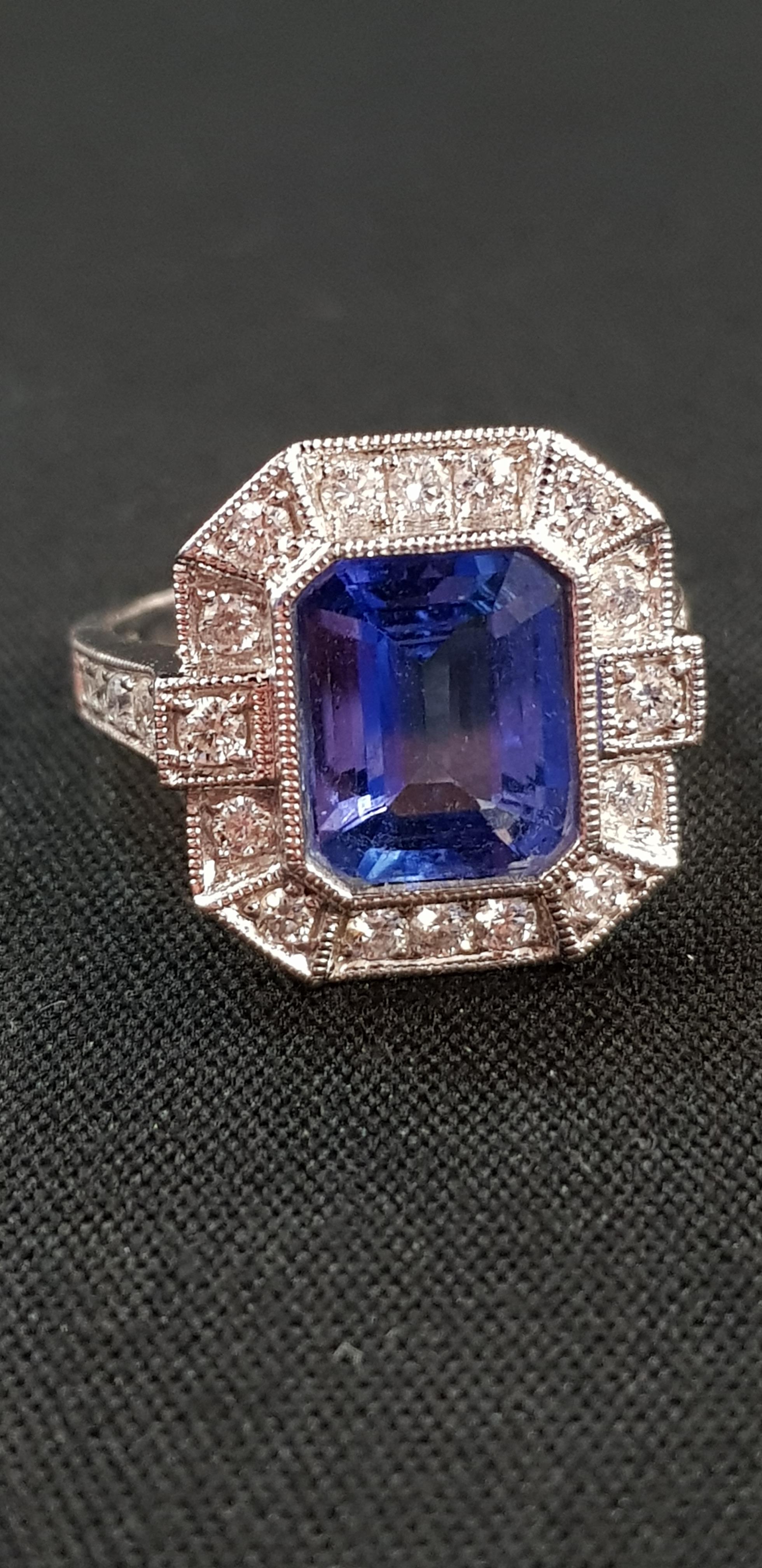 18CT WHITE GOLD DIAMOND AND TANZANITE RING 3 CARAT TANZANITE AND 0.75 CARAT OF DIAMONDS