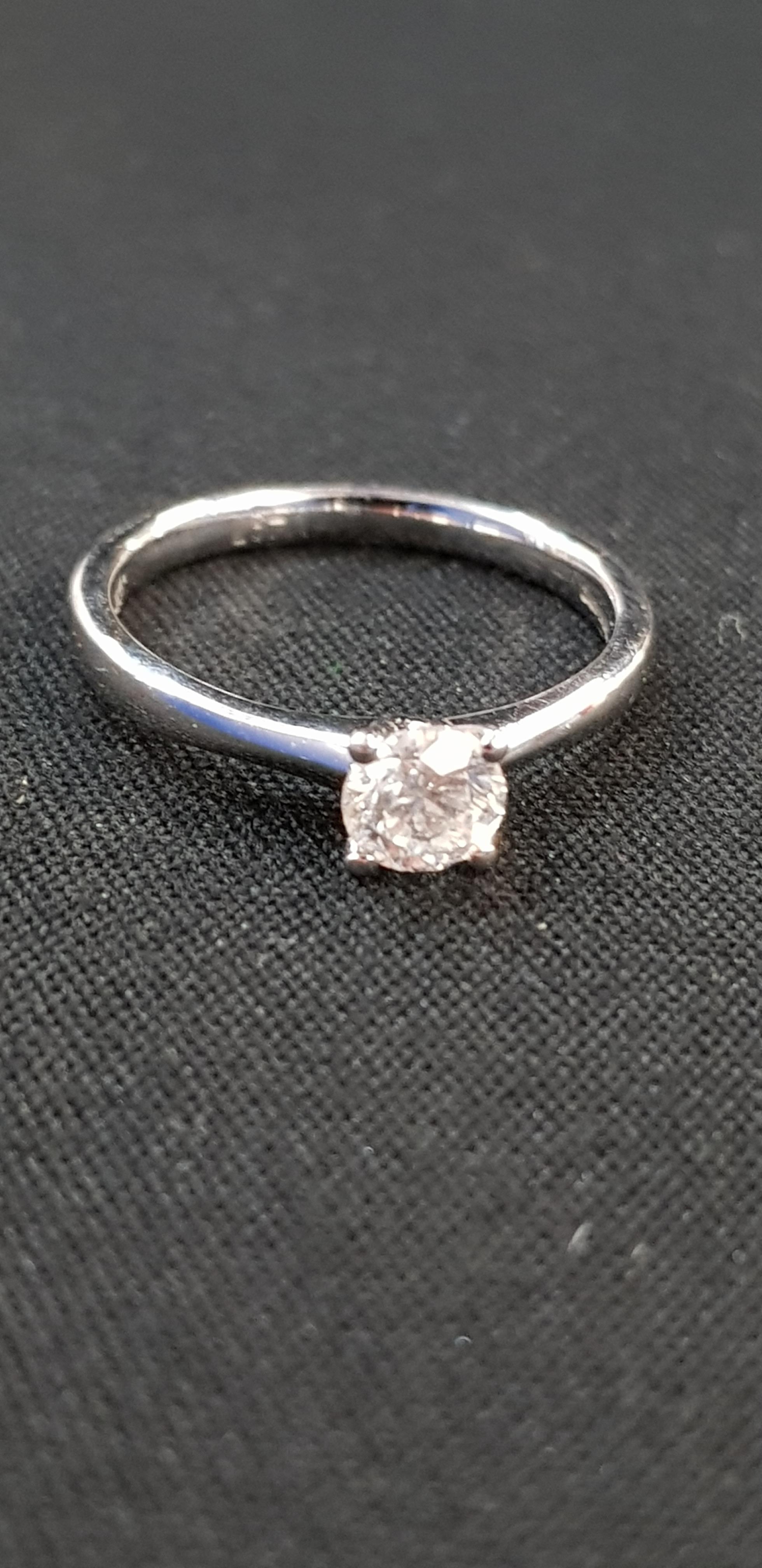 18CT WHITE GOLD DIAMOND RING WITH OVER A HALF CARAT SOLITAIRE