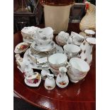 SHELF LOT OF TEASETS AND COUNTRY ROSE ITEMS