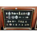 FRAMED BOARD OF MILITARY BADGES