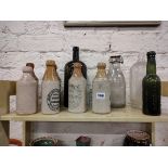 QUANTITY OF STONEWARE AND ANTIQUE GLASS BOTTLES