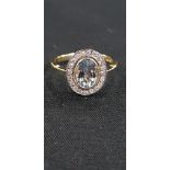 18CT GOLD AQUAMARINE AND DIAMOND RING