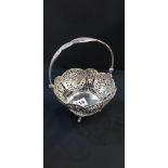 SOLID SILVER BASKET WITH FOLDING HANDLE. HIGHLY ORNATE WITH PIERCED DETAIL DEPICTING BIRDS AND