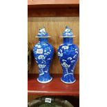 PAIR OF CHINESE BLUE AND WHITE PRANUS PATTERN VASES (CHIPS TO LIDS)