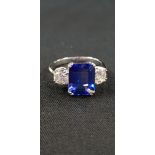 PLATINUM SET TANZANITE (3.9 CARATS) & DIAMOND (1.03 CARATS) THREE STONE RING