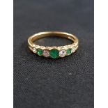 18CT YELLOW GOLD DIAMOND AND EMERALD RING WITH 0.20 CARAT OF DIAMONDS SIZE O