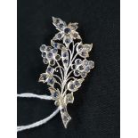 WHITE METAL SAPPHIRE SET FLORAL BROOCH