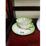 2ND PERIOD BELLEEK GREEN SHELL CUP AND SAUCER