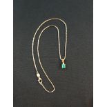 18 CARAT GOLD COLUMBIAN EMERALD & DIAMOND DROP ON 14 CARAT GOLD CHAIN