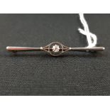 GOLD SOLITAIRE DIAMOND BAR BROOCH CIRCA 0.25 CARAT (NO HALLMARK BUT TESTED)