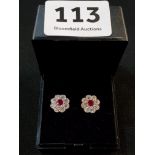 18CT WHITE GOLD EARRINGS, SOLITAIRE RUBY AND SURROUND DIAMONDS