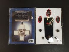 ROYAL ULSTER CONSTABULARY GEORGE CROSS PRESENTATION BOOKLET AND COLLECTION OF RUC BADGES, BUTTONS