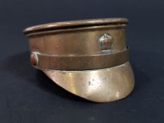 GERMAN WW1 TRENCH ART PEAKED CAP ASHTRAY/PAPERWEIGHT DATED 1916