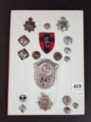 SHEET OF POLICE BADGES AND BUTTONS