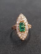 18 CARAT GOLD FABULOUS NAVETTE RING. LARGE CENTRE EMERALD SURROUNDED BY DIAMONDS.