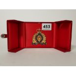 CASED ROYAL CANADIAN MOUNTED POLICE CAP BADGE