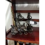 Shelf lot of metal figures