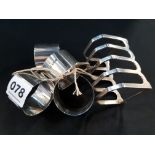 SILVER TOAST RACK AND 4 SILVER NAPKIN RINGS 188G