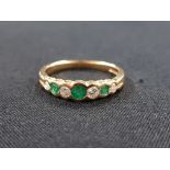 18CT YELLOW GOLD DIAMOND AND EMERALD RING WITH 0.20 CARAT OF DIAMONDS SIZE O