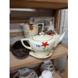 Shelf lot of tea and coffee pots