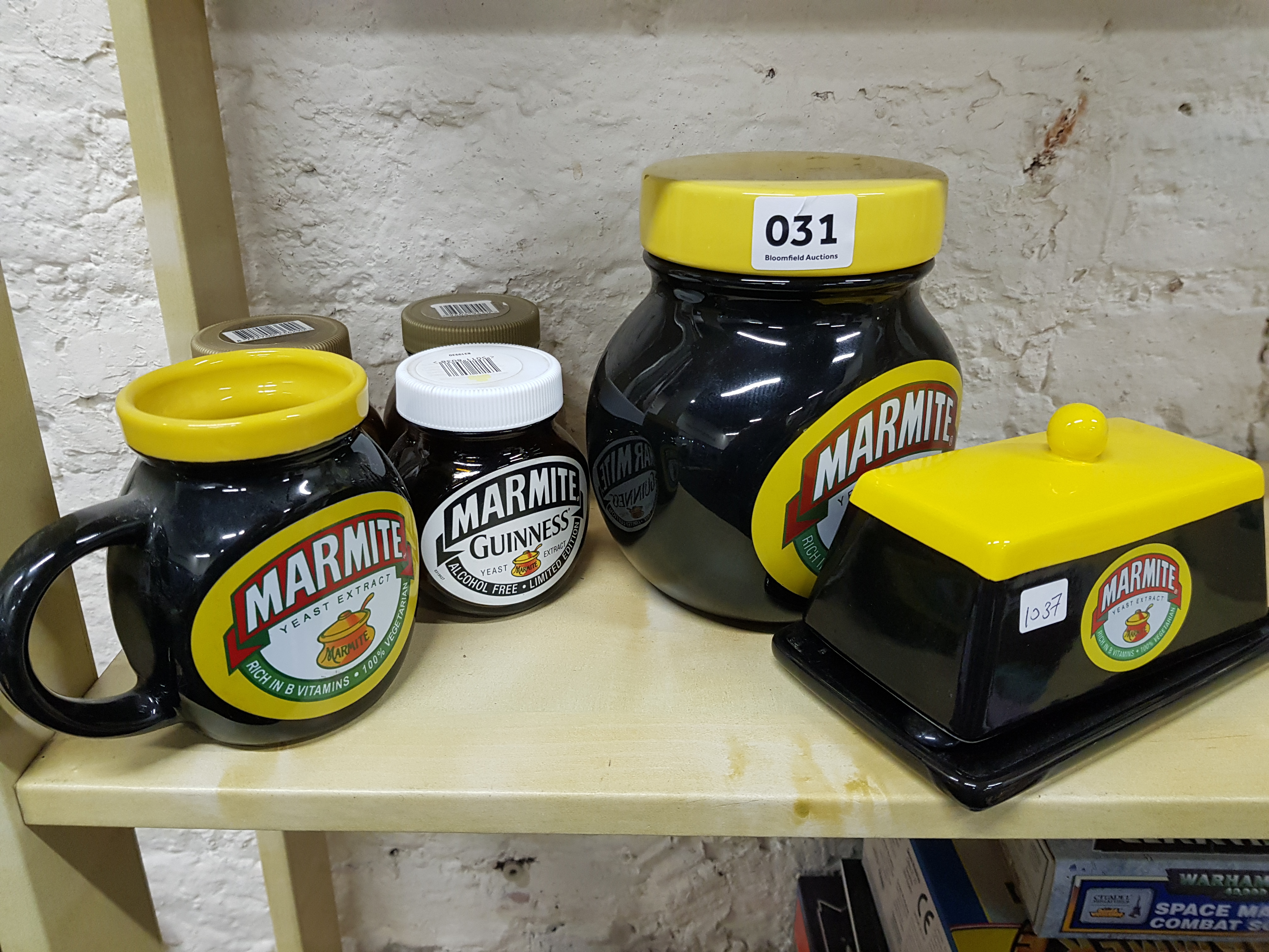 Shelf lot of old Marmite jars