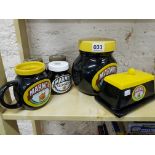 Shelf lot of old Marmite jars