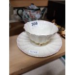 BELLEEK SHELL CUP AND SAUCER