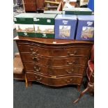 SERPENTINE GRADUATED CHEST OF DRAWERS