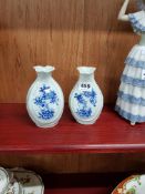 PAIR OF ANTIQUE ORIENTAL BLUE AND WHITE VASES