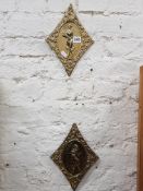 PAIR OF BRASS LADY PLAQUES
