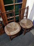 PAIR OF CHAIRS WITH ROUND SEATS FROM THE SUSSEX RANGE POSSIBLY DESIGNED BY FORD MADOX BROWN