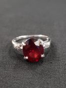 9 CARAT GOLD RED STONE AND DIAMOND RING