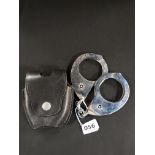 VERY RARE ROYAL ULSTER CONSTABULARY 1960 PATTERN HIATTS HANDCUFFS AND BLACK LEATHER POUCH