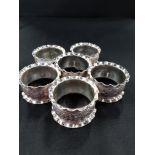 6 WHITE METAL NAPKIN RINGS