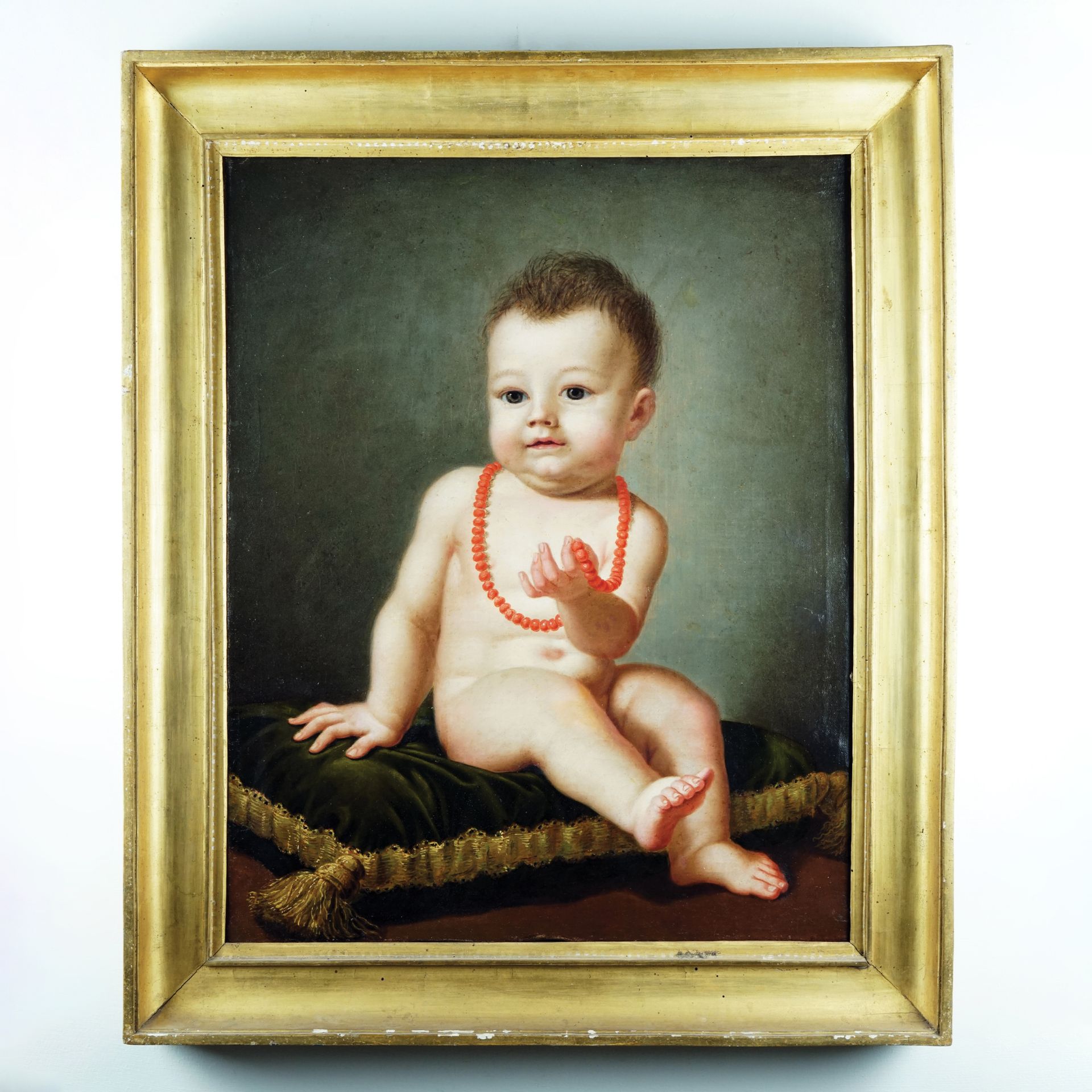 Early 19th century painter Sitting baby with a coral necklaceoil on canvas, 62,5x50cm.