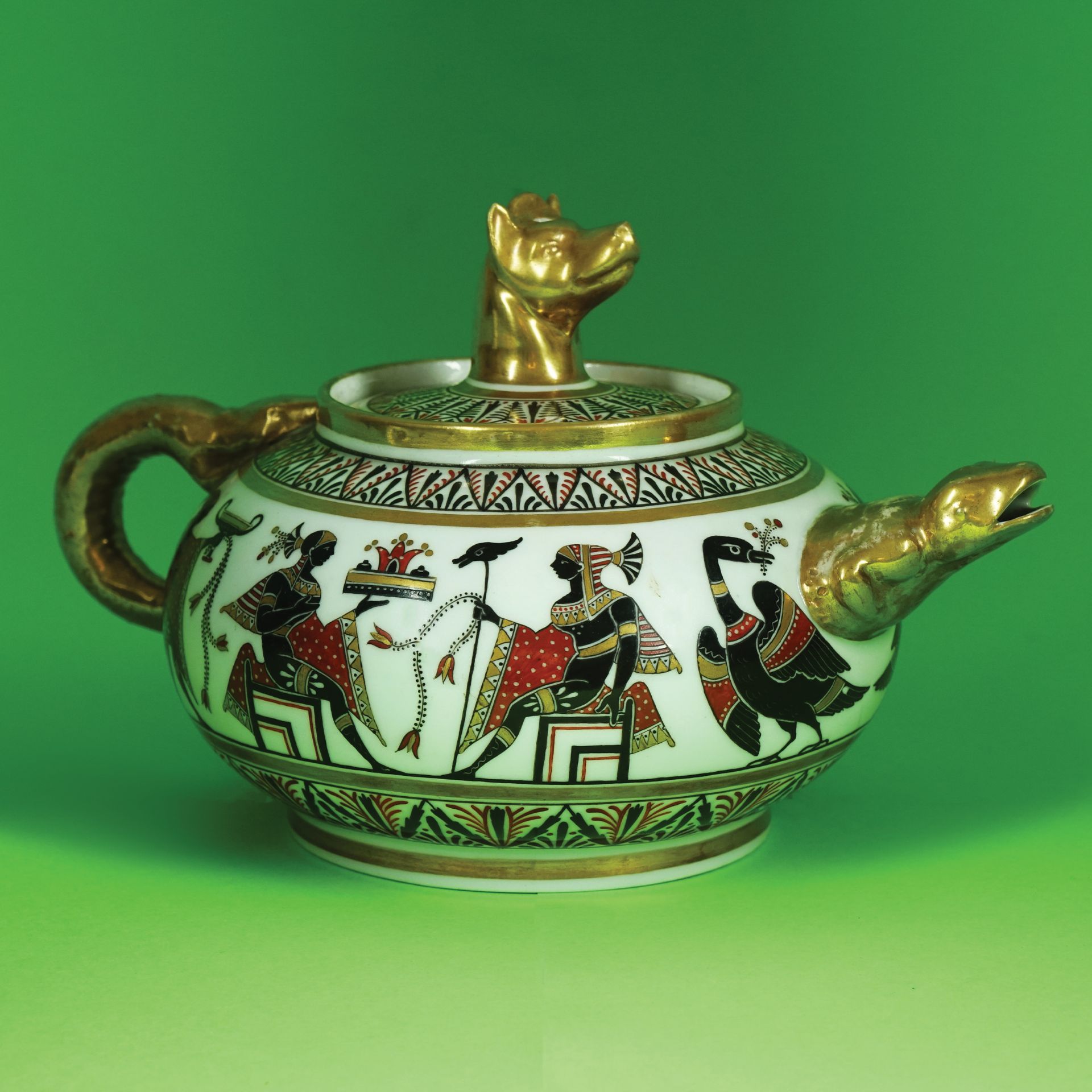 A Neapolitan white, gilt and polychrome polcelain teapot, Giustiniani, 1830 circa 17by28cm. (