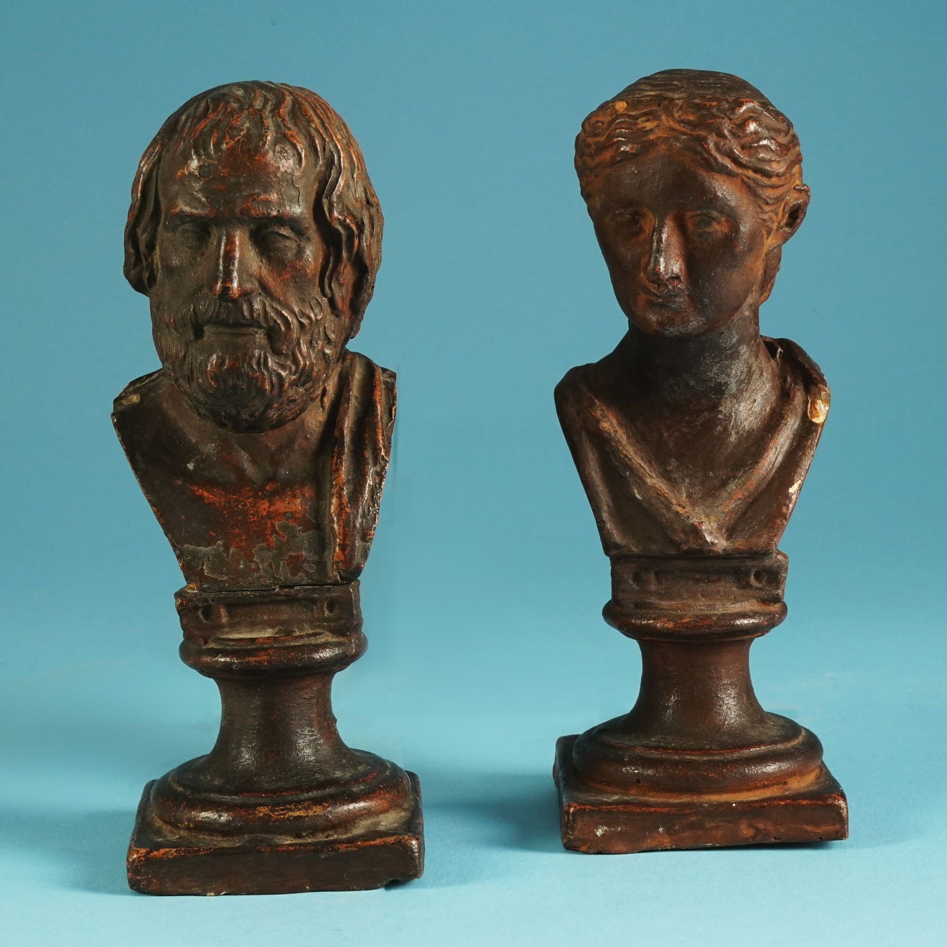 A pair of Neapolitan patinated terracotta small busts, 19th century 20cm. high each (small chips)