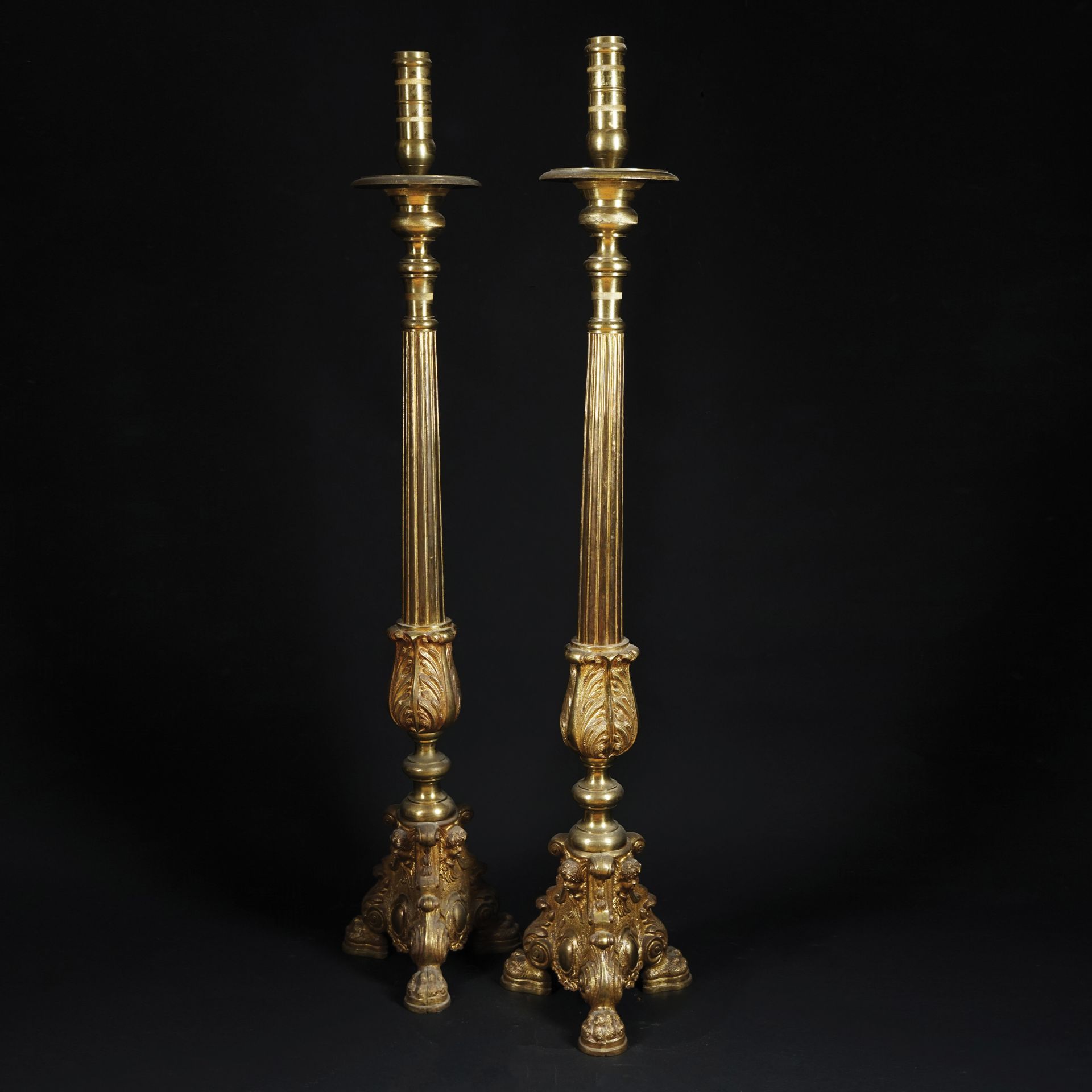 A pair of chiseled gilt bronze torcieri, 19th century 118cm. high each