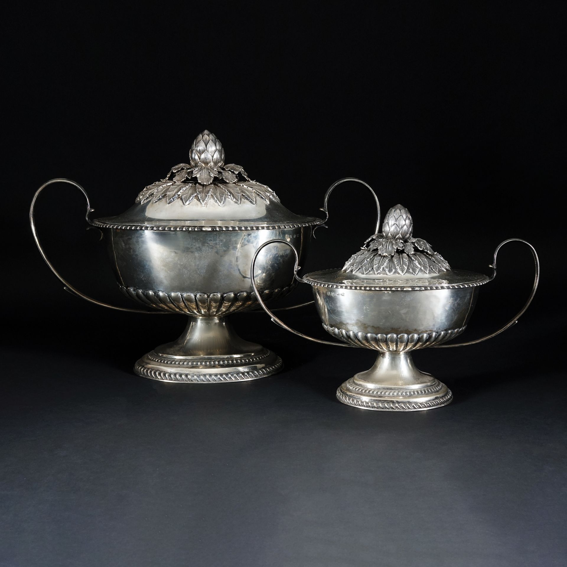 2 sterling silver tureens and covers, London, 1778, John Scofield 33x47x26cm. and 24x35x18cm., 4.