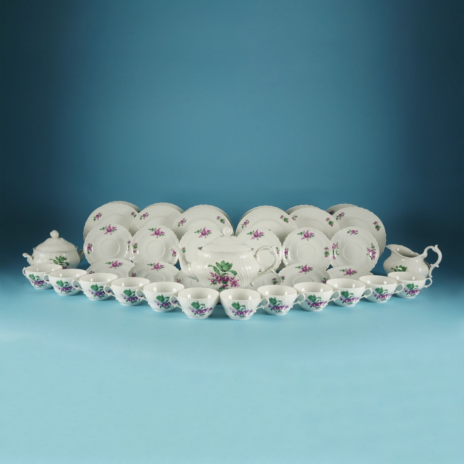 An Italian white and polychrome tea service, Richard Ginori comprising 12 tea cups and plate, 12