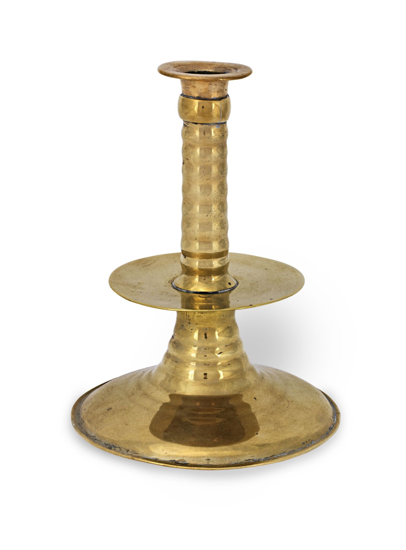 A mid-17th century and later brass trumpet-base candlestick, English, circa 1650-80