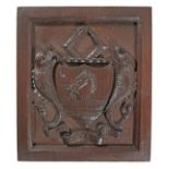 A 19th century carved oak armorial panel, English